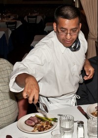 A waiter serving dinner, representing copywriting service offerings